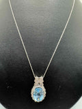 10ct White Gold Necklace With Blue Topaz Pendant